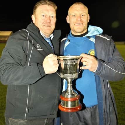 Lions chairman Andy Moore (left) and last season's head coach Darren Fox with the East Midlands Cup.
