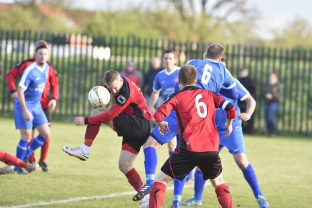 Action From Netherton United's 1-0 win at Whittlesey Athletic (blue). Photo: David Lowndes.