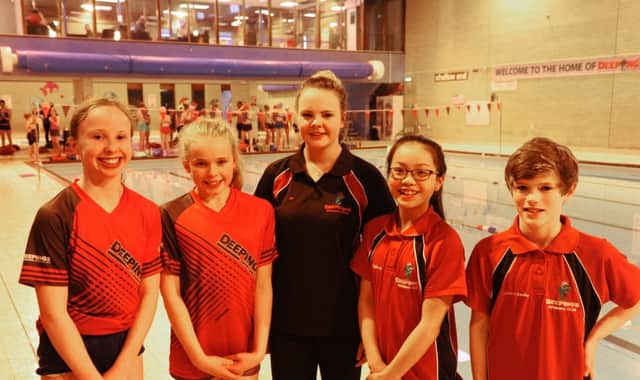 The Deepings Swimming Club quartet  Jessica OHerlihy, Molly Briers, Tiffany Wong and Alex Sadler with assistant coach Zoe Fisher (centre) - who competed at the East Midlands Age Group Championships.