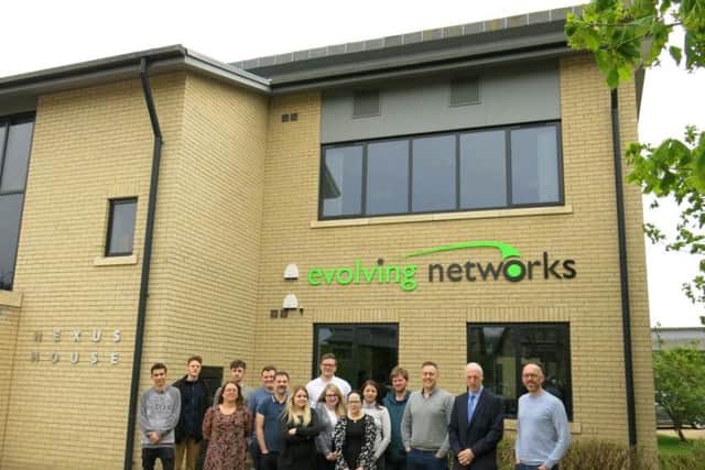 The Evolving Networks team outside their new home.