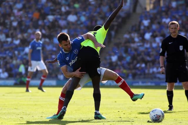 Posh midfielder Leo Da Silva Lopes in a battle for the ball at Portsmouth. Photo: Joe Dent/theposh.com.