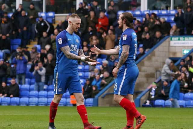 Posh top scorer Jack Marriott (right) with king of the assists Marcus Maddison.