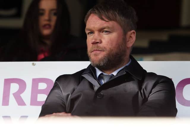 Old Posh boss Grant McCann ahead of his final game in charge against Wilmbledon.