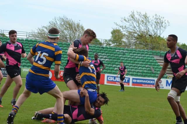 Hudson Rees-Jones and Ronan Rawlings tackling for Peterborough Regional College.