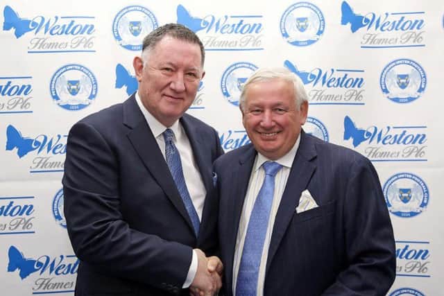 Posh chief executive Bob Symns (left) and Weston Homes chief executive and chairman Bob Weston shake on a sponsorship deal.