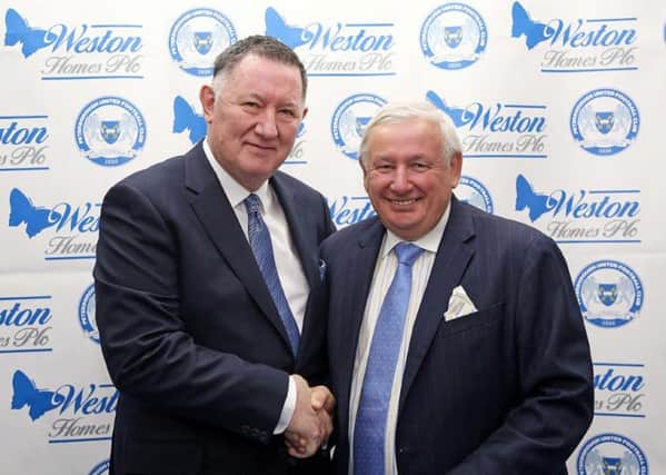 Posh chief executive Bob Symns (left) and Weston Homes chief executive and chairman Bob Weston shake on a sponsorship deal.