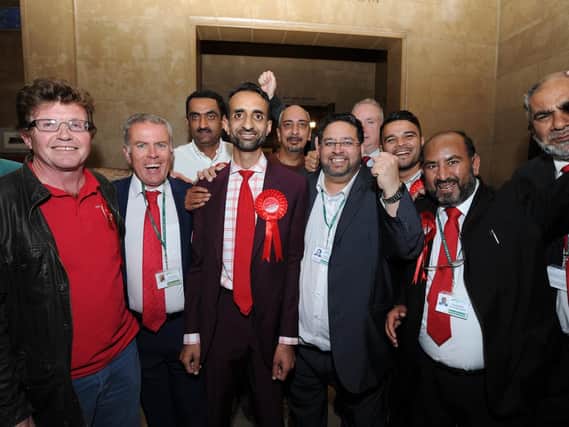 Cllr Shaz Nawaz (from and centre with the red rosette) alongside fellow Labour councillors and activists following his by-election victory in August 2017