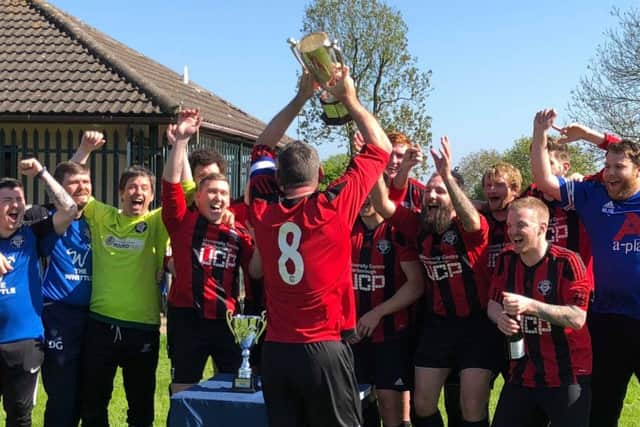 Cardea celebrate the Division Three title and promotion to Division Two.