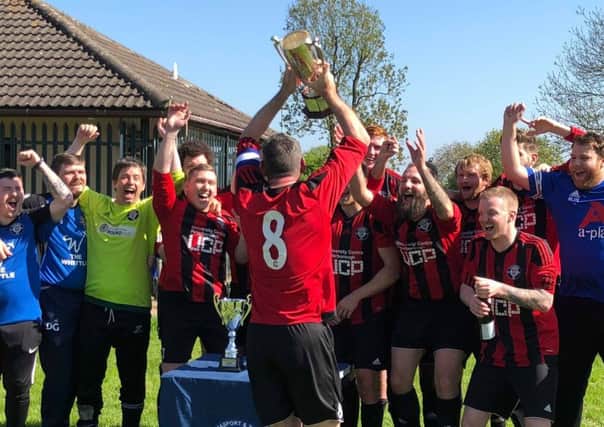 Cardea celebrate the Division Three title and promotion to Division Two.