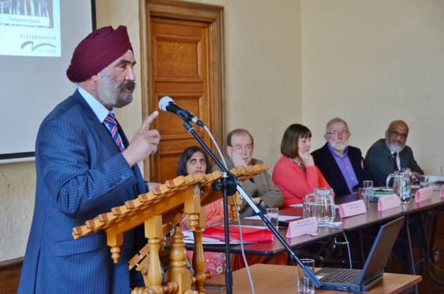The Peterborough Inter-Faith Council Faith Festival and Food when it was at Peterborough Town Hall. Dr Jaspal Singh speaking EMN-160515-160400009