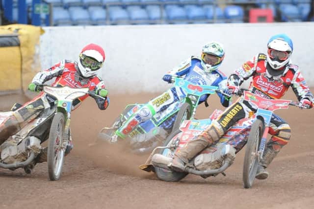 Action from Panthers v Workington with Emil Grondal (red helmet) and Simon Lambert riding hard for the city side in heat eight. Photo: David Lowndes.