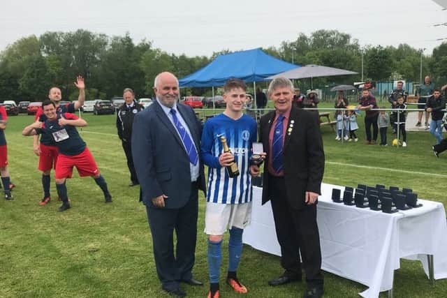 Declan Earth of Moulton Harrox Reserves with his man-of-the-match prize from the Chairman's Shield Final.