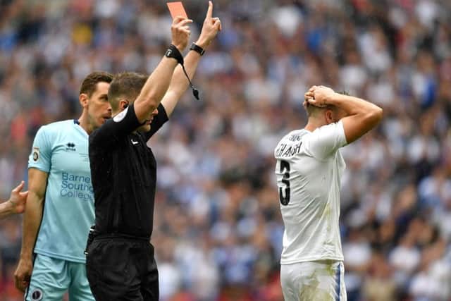 Neil Hair shows Liam Ridehalgh a red card in the first minute of the National League play-off final at Wembley.