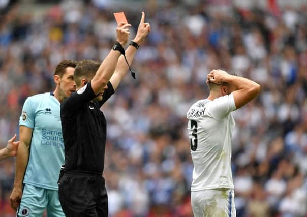 Neil Hair shows Liam Ridehalgh a red card in the first minute of the National League play-off final at Wembley.