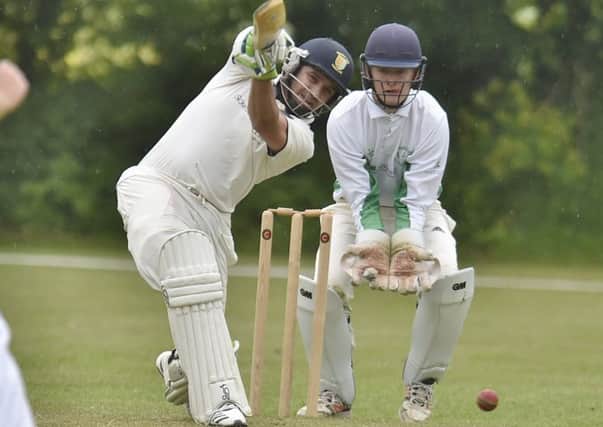 Liam Dave hits out on his way to 42 not out for Stamford against Castor. Photo: David Lowndes.