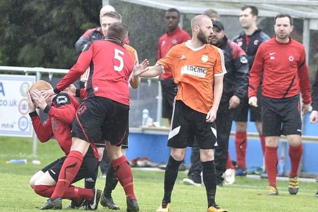 Thorney's Sam Donohoe (orange) was sent off in the President's Shield Final.  Photo: David Lowndes