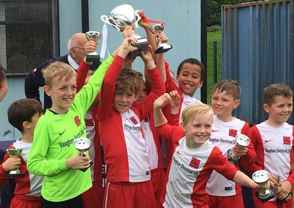 One Touch celebrate their success in th eUnder 9 League Cup final.