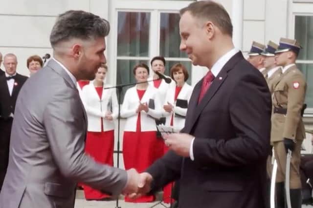 Damian Wawrzyniak receiving his award from the President of Poland.
Photo: Prezydent PL