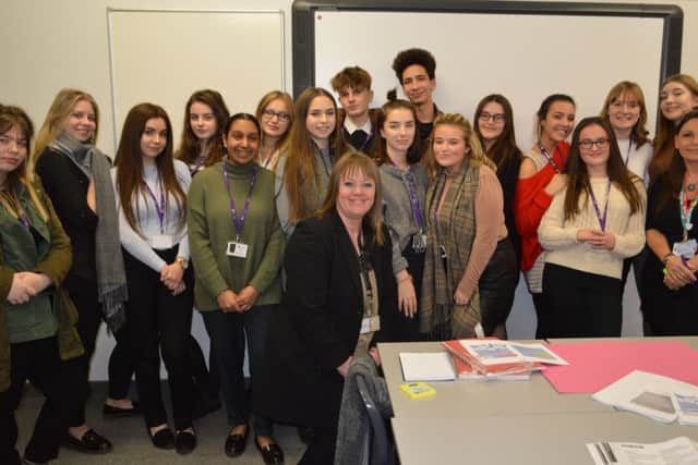 The student champions together with teacher and lead for the project, Sam Lawrence.
