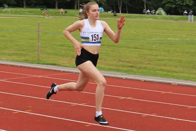 Elizabeth Taylor strides to success in the 300m.