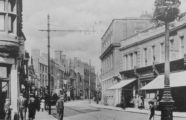 This picture shows a relatively bustling Westgate with the Bull Hotel on the right.This  was taken in 1920s and you can make out the tram tracks in the road.