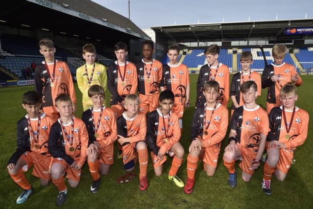 Yaxley Under 13s after their PFA Cup final defeat at the ABAX Stadium. Photo: David Lowndes.