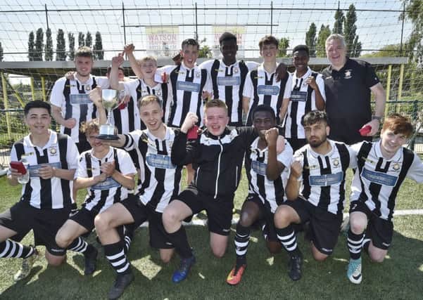Peterborough Northern Star Under 18s celebrate their title win.
