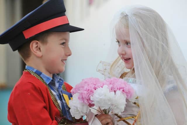 Mock Royal Wedding at the Discovery primary school. Foundation pupils Millie and Kai are the bride and groom. EMN-180519-081447009