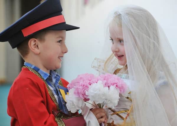 Mock Royal Wedding at the Discovery primary school. Foundation pupils Millie and Kai are the bride and groom. EMN-180519-081447009