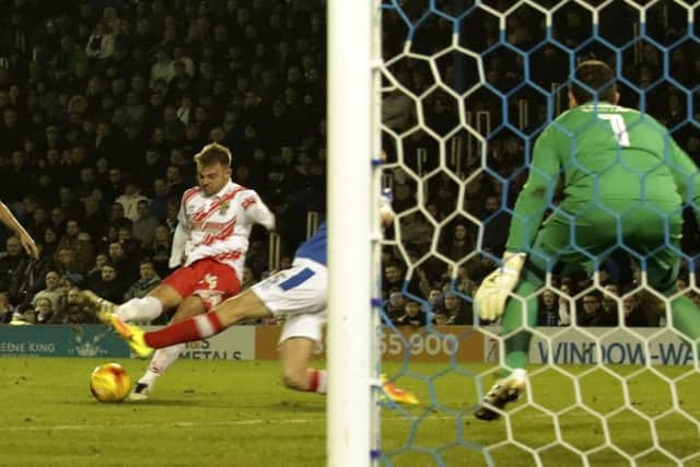 Matt Godden scores for Stevenage against Portsmouth.