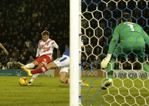 Matt Godden scores for Stevenage against Portsmouth.