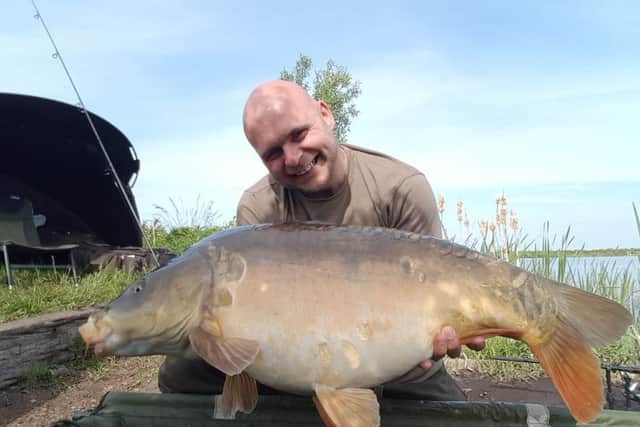 Trevor Hopkins pictured with a the biggest carp caught this year from Float Fish Farm. It weighed 35lb.