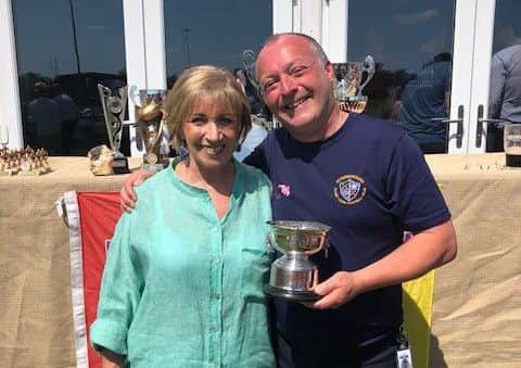 Simon Potter receives his Clubman of the Year award from last years winner and club treasurer Marge Beuttell.