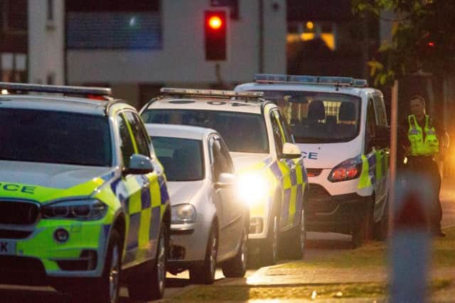 Police at the scene of the arrest in Coneygree Road, Peterborough. Photo: Terry Harris