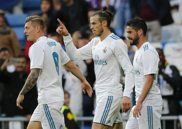 Gareth Bale (centre) celebrates another Real Madrid goal.
