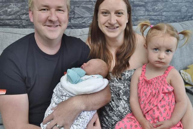Paul Fisher with wife Amy, daughter Sky (2) and new baby Kylo