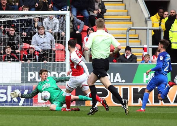 Conor O'Malley of Peterborough United makes a save to deny Anthony Forde of Rotherham United. Picture: Joe Dent