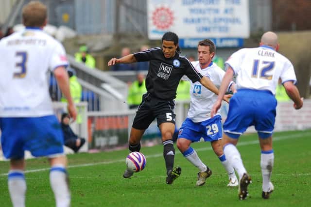 Experienced centre-back Chris Westwood (black shirt) was a successful Posh signing.