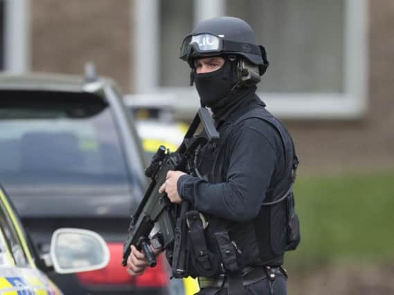 Armed police are at the scene.