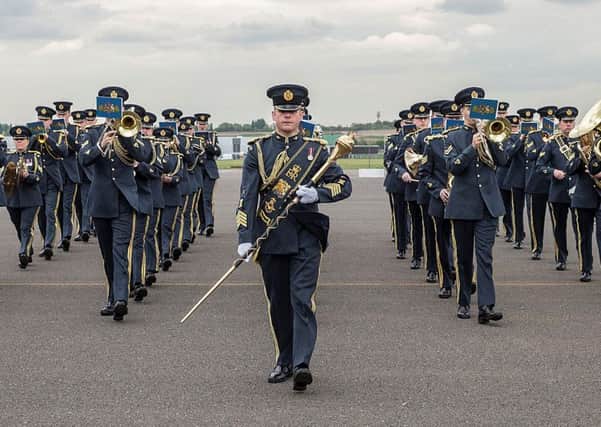 RAF Central Band Group Photograph and marching on parade square
Image By: Corporal Ben Tritta