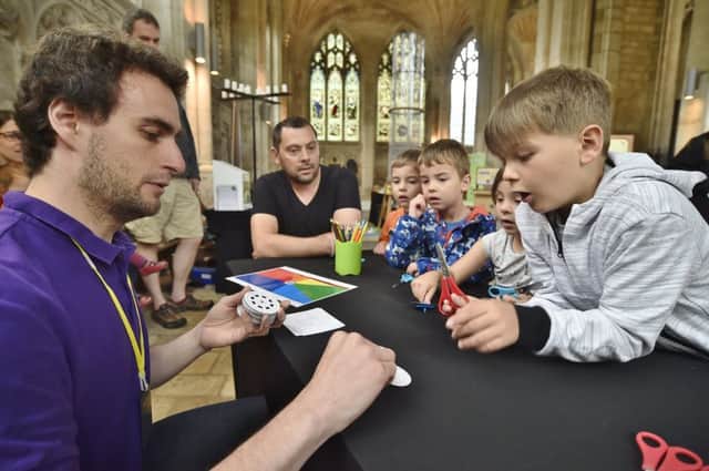 COSMOS, amazing science at home  roadshow at Peterborough Cathedral. Andrew Farrer with local children EMN-180526-181133009