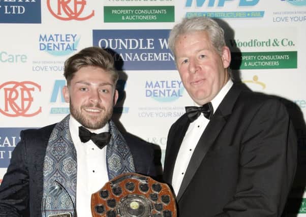 Oundle first XV player of the Year Will Carrington with club president David Dales.