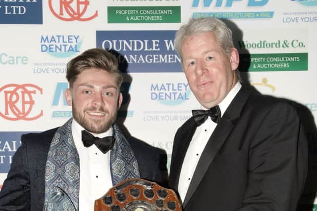 Oundle first XV player of the Year Will Carrington with club president David Dales.