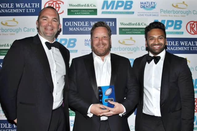 Second XV player of the year Chris Brown with head coach Jon Phillips (left) and club chairman  Alykhan Kachra.