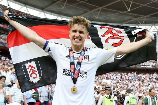 Fulham's Tom Cairney celebrates promotion to the Premier League.