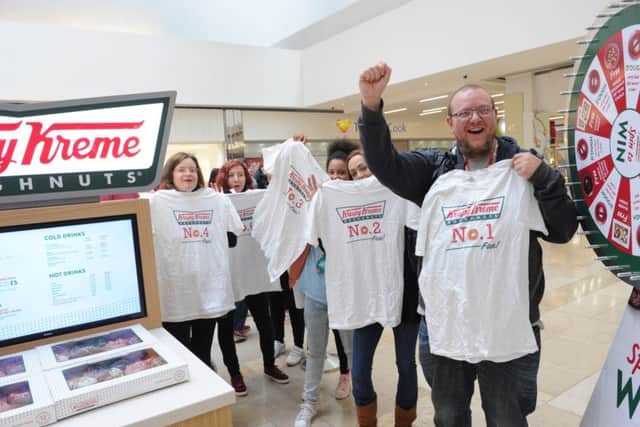 The first people in the queue at the new Krispy Kreme store