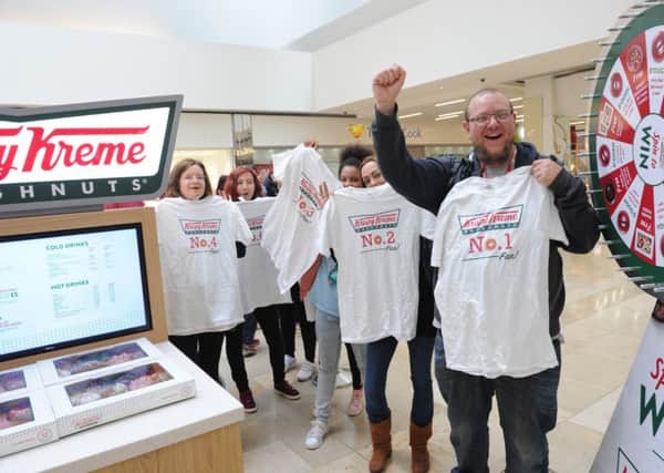 The first people in the queue at the new Krispy Kreme store