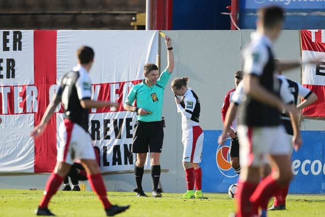 Referee Neil Hair in action.