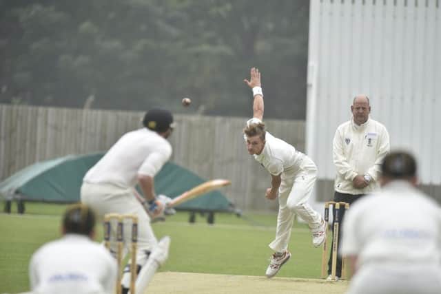 Fast bowler David Sayer in action for Peterborough Town against Brixworth. Photo: David Lowndes.