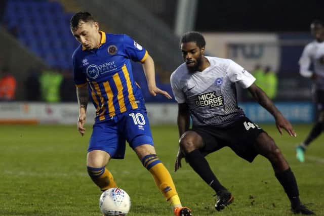 Anthony Grant (right) in action for Posh against Shrewsbury.